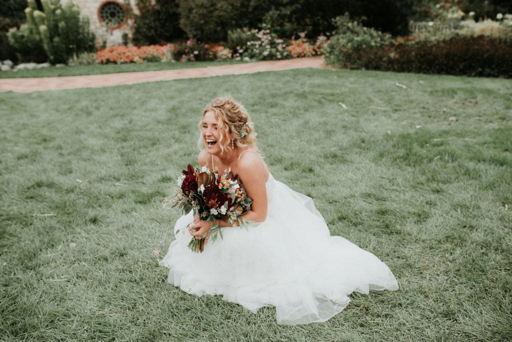 bride laughing at Green Bay botanical garden wedding