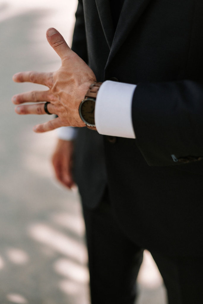 groom's hand with watch and ring