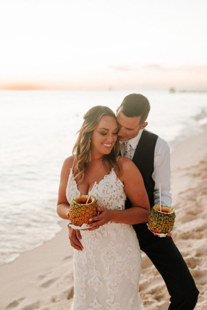 bride and groom drinking out of pineapples at destination Dominican beach wedding