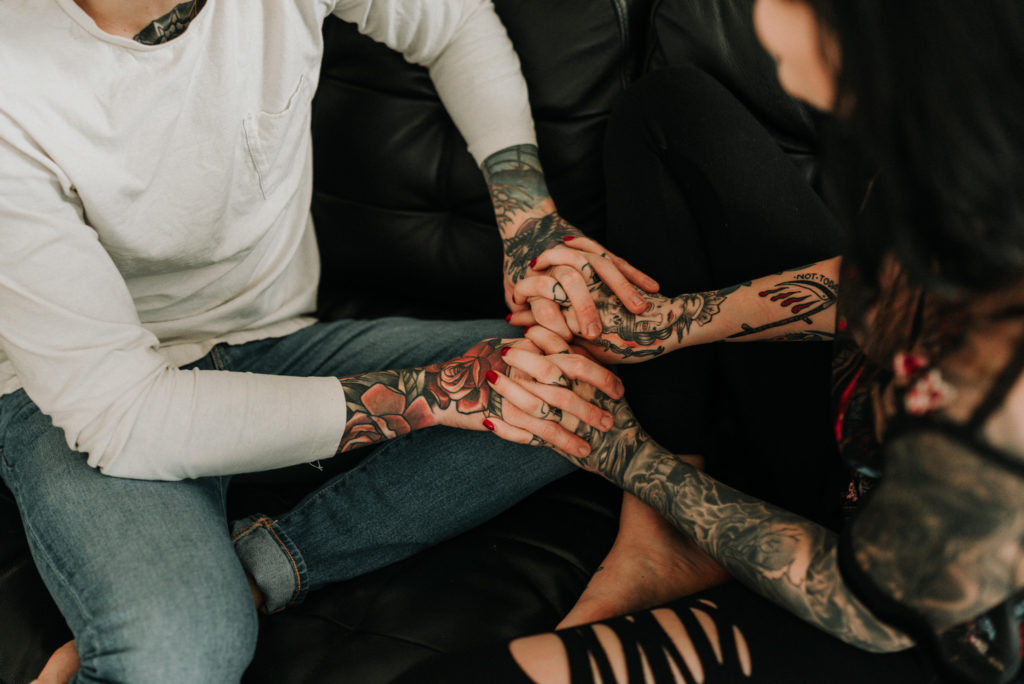 couple photoshoot ideas holding hands with tattoos