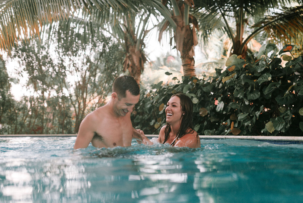 couple in pool after destination elopement