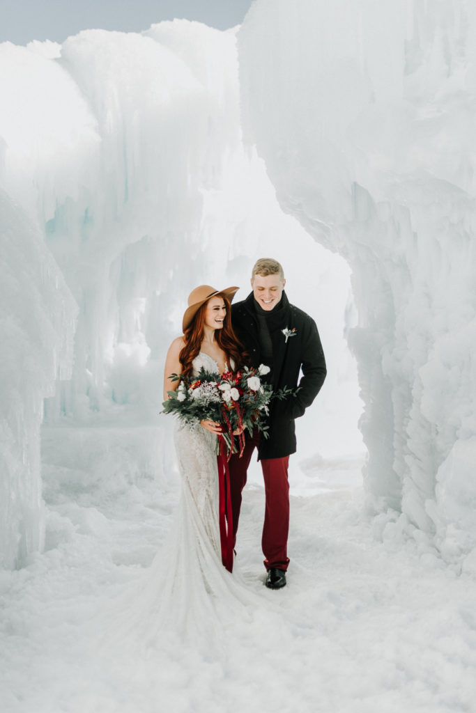 bride and groom eloping in mn ice castle