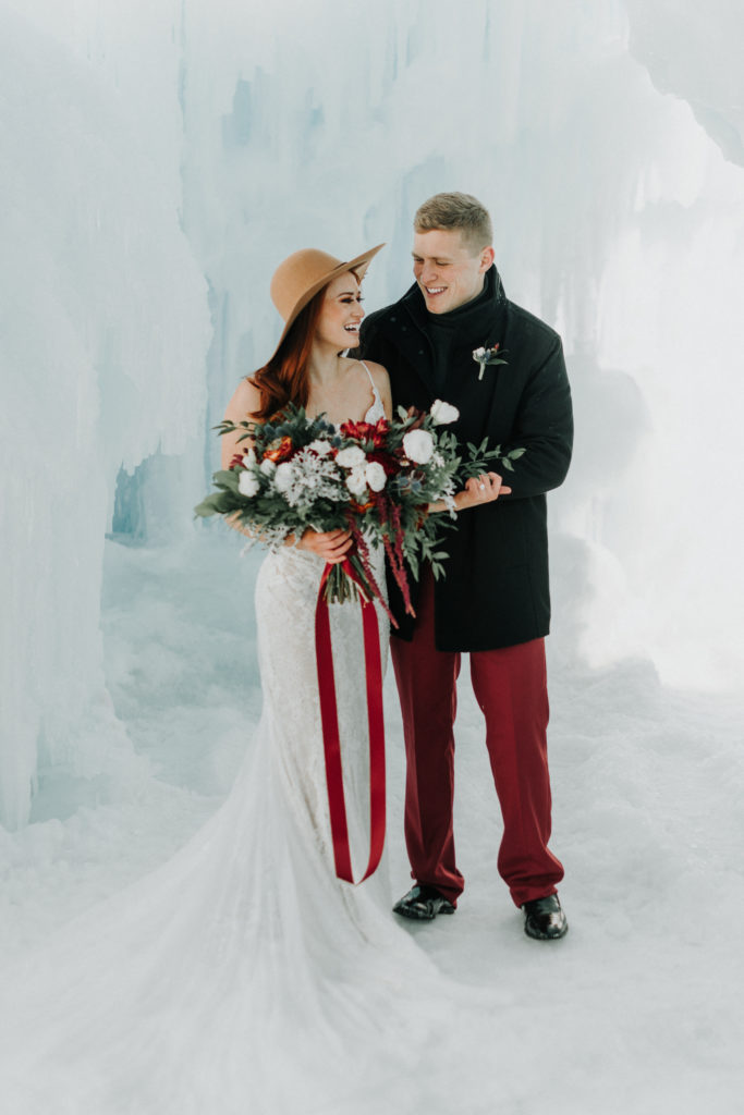 bride and groom eloping in mn ice castle
