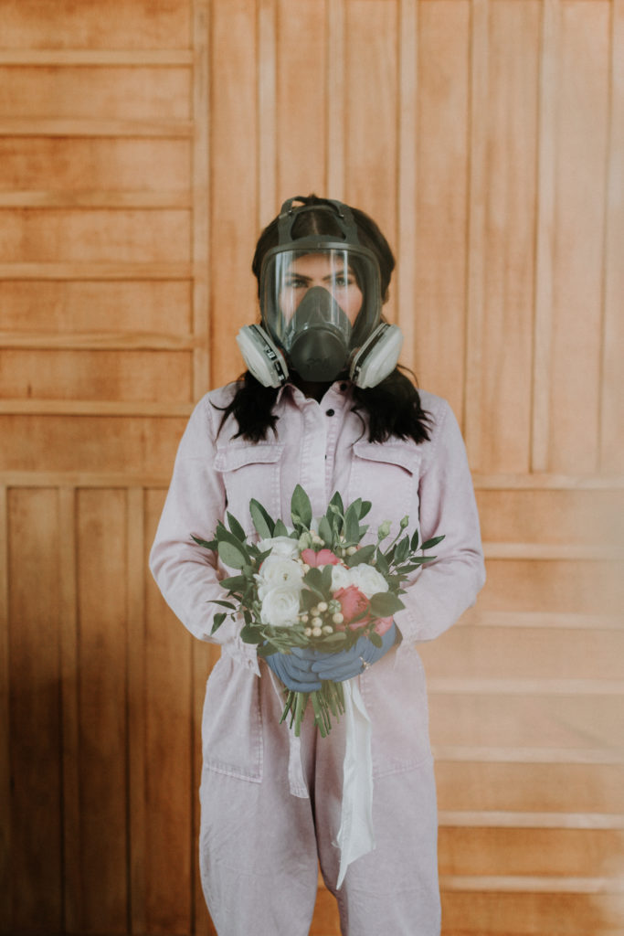 bride with bouquet and mask at coronavirus wedding