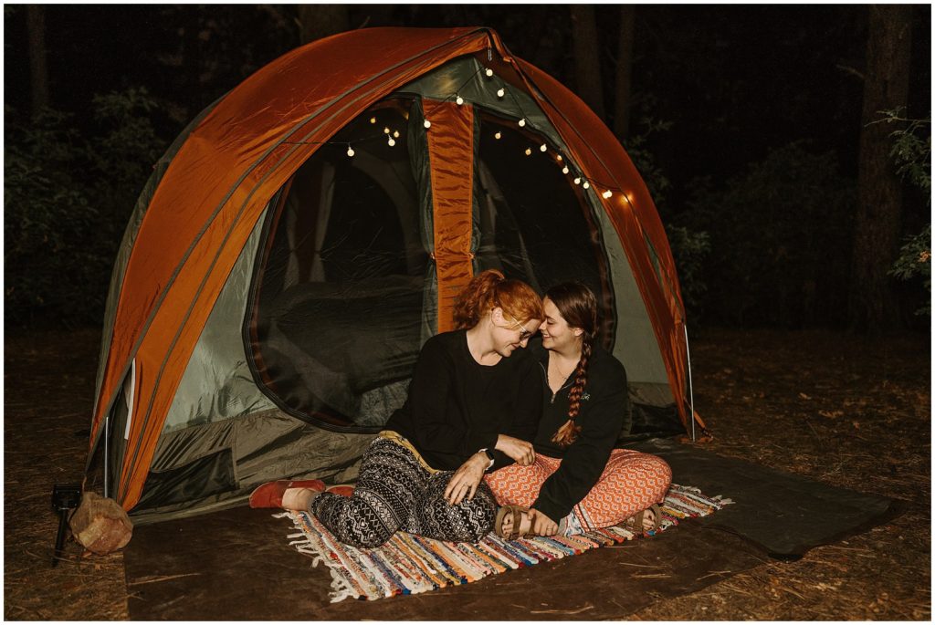 two girls camping in the forrest